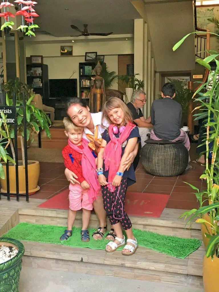 Our kids with their scarves saying goodbye at One Up Banana Hotel, Phnom Penh